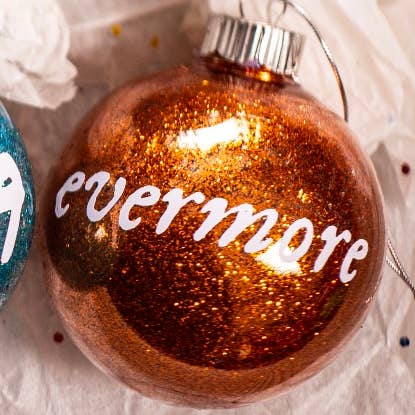 Taylor Swift Christmas Ornament | Glitter | Plastic | Eras: Folklore / Round 2.36”