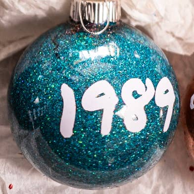 Taylor Swift Christmas Ornament | Glitter | Plastic | Eras: Folklore / Round 2.36”