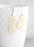 Skeleton Wing Earrings | Matte Gold | Wings and Whimsy