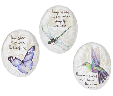 Three decorative stones with illustrations of a butterfly, dragonfly, and hummingbird, each with a motivational quote.